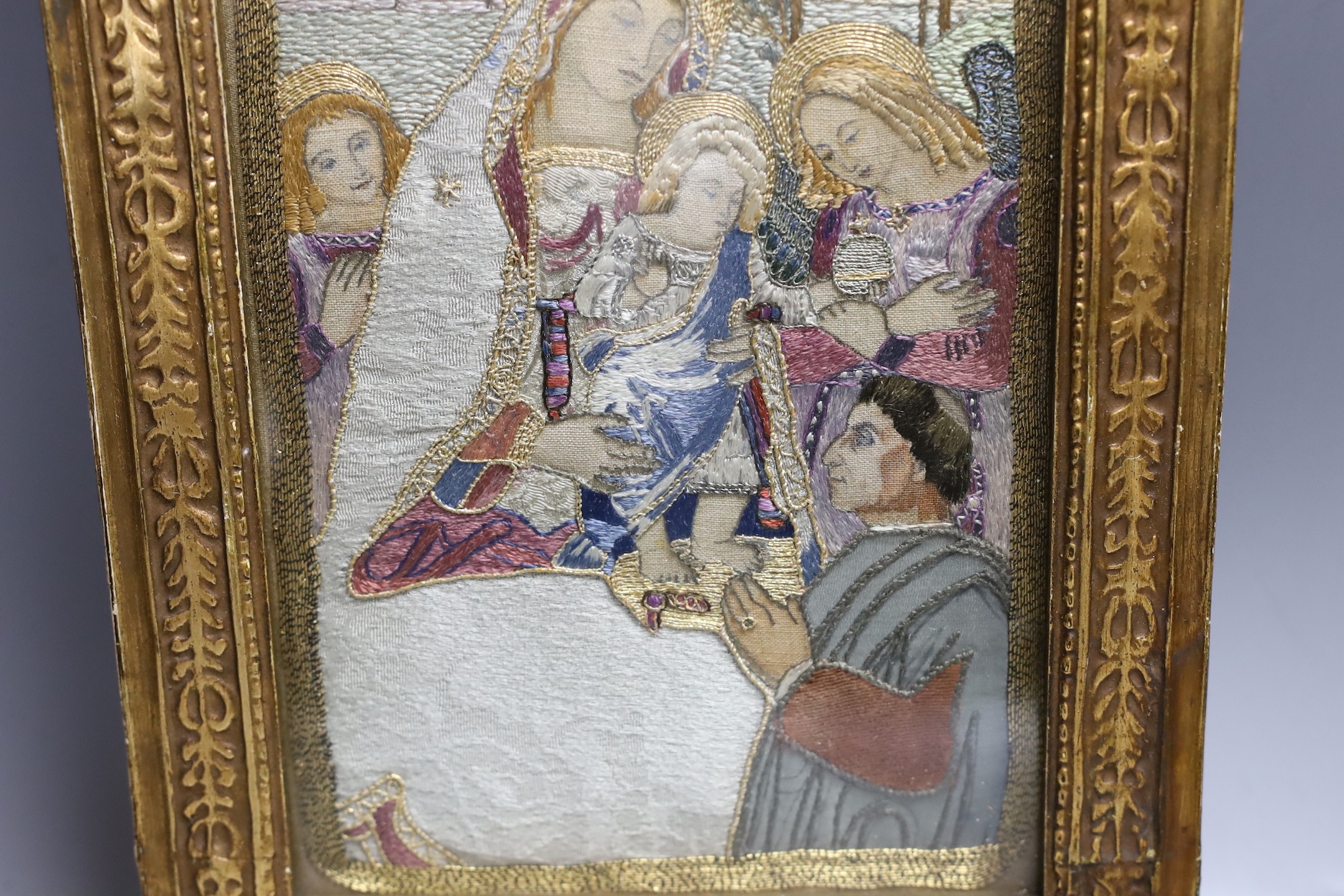 A silk thread embroidery of the 'Madonna of Peace', 36x24cm including gilt frame